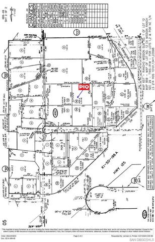 an aerial view of a house with a swimming pool