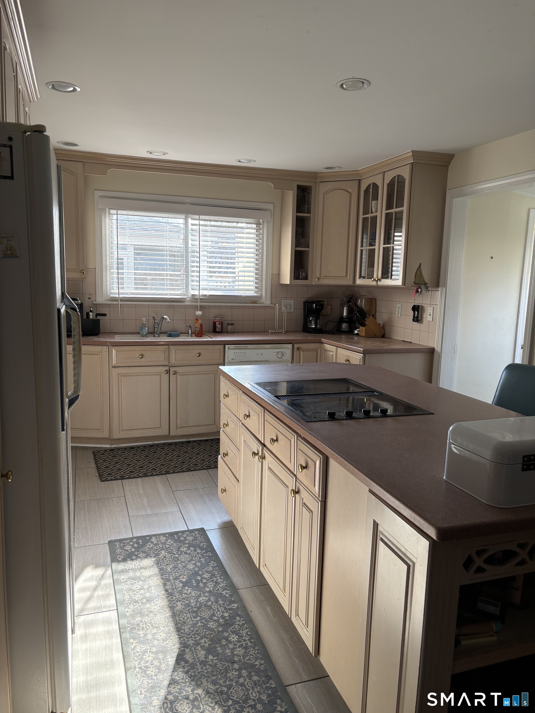 41 Sunrise Avenue Niantic, CT 06357 - Photo 12 of 15 a kitchen with stainless steel appliances granite countertop a sink stove and refrigerator