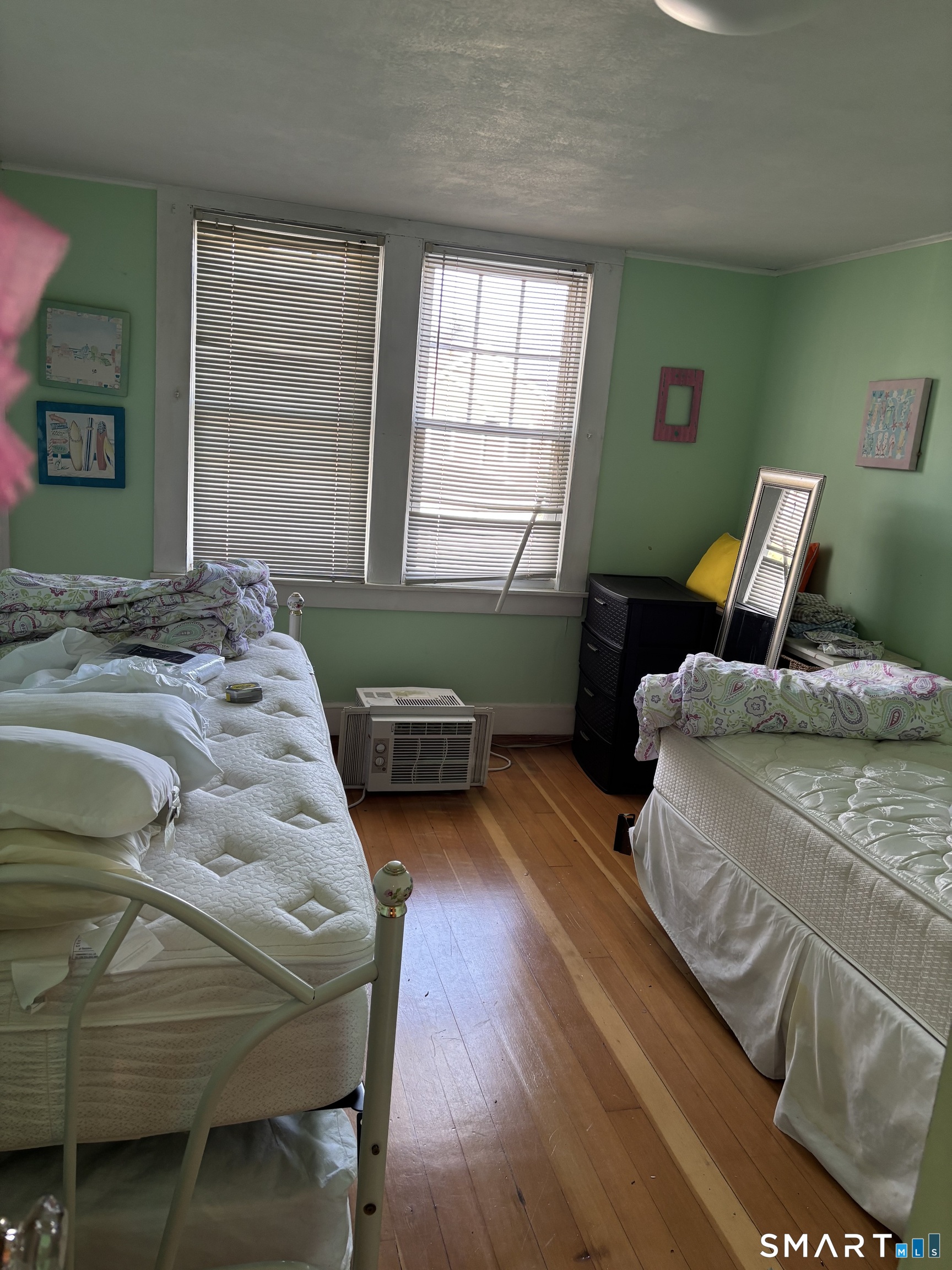 41 Sunrise Avenue Niantic, CT 06357 - Photo 7 of 15 a bedroom with a bed and windows