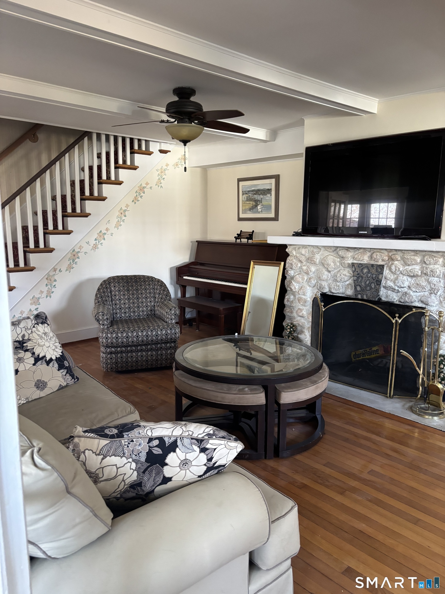 41 Sunrise Avenue Niantic, CT 06357 - Photo 10 of 15 a living room with furniture and a fireplace