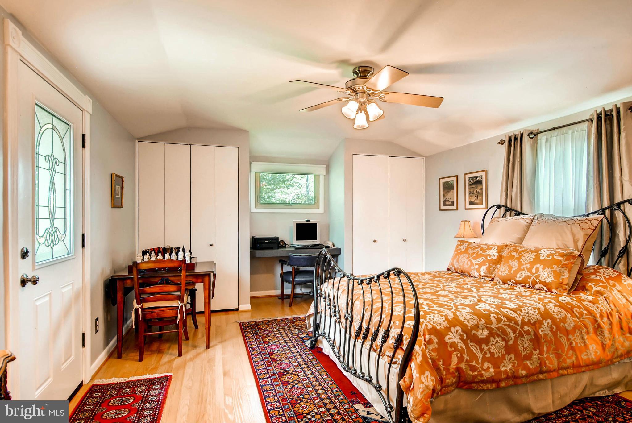 1202 Windy Gate Road Towson, MD 21286 - Photo 13 of 29 a bed room with a bed and a chair