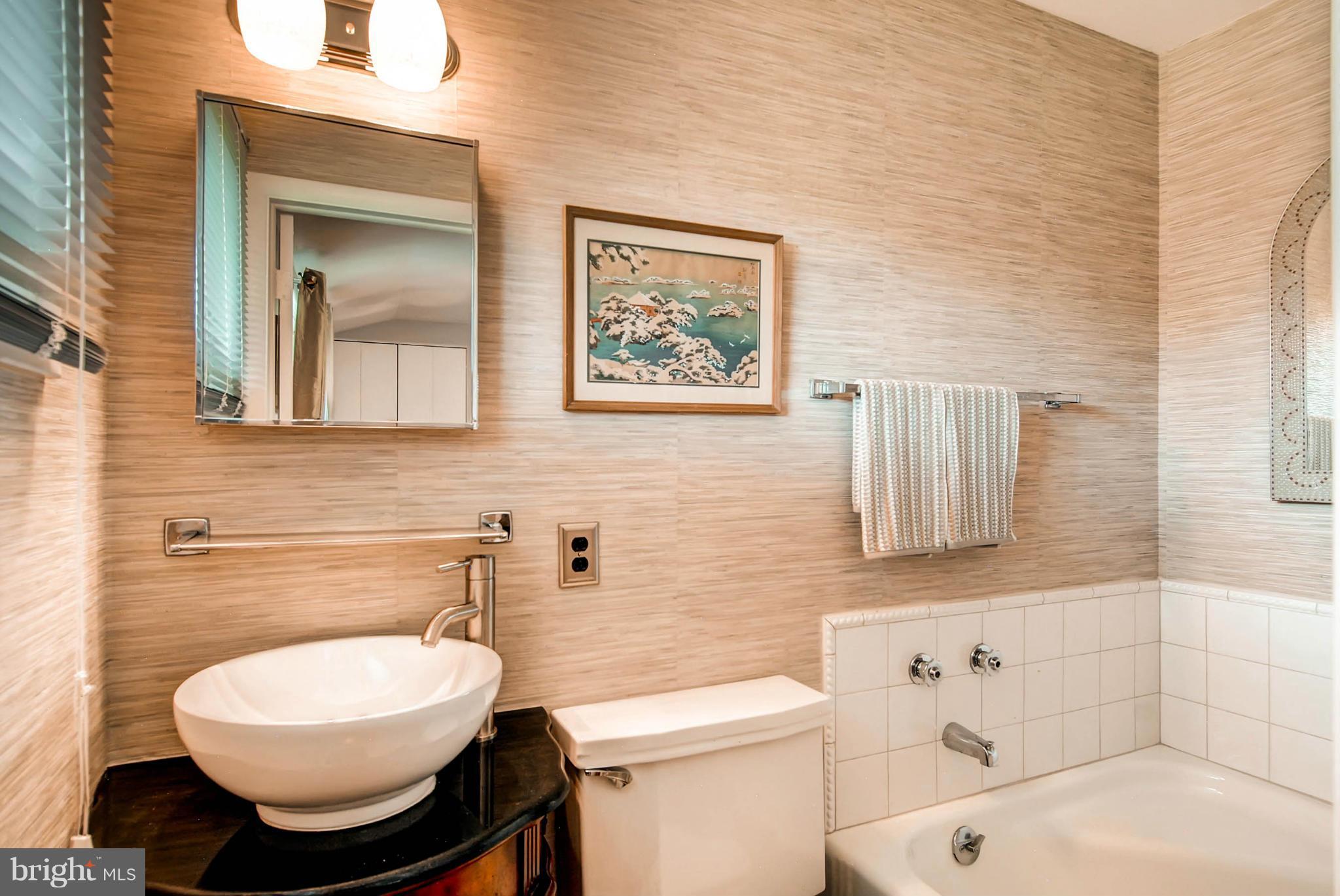 1202 Windy Gate Road Towson, MD 21286 - Photo 16 of 29 a bathroom with a toilet a sink and mirror