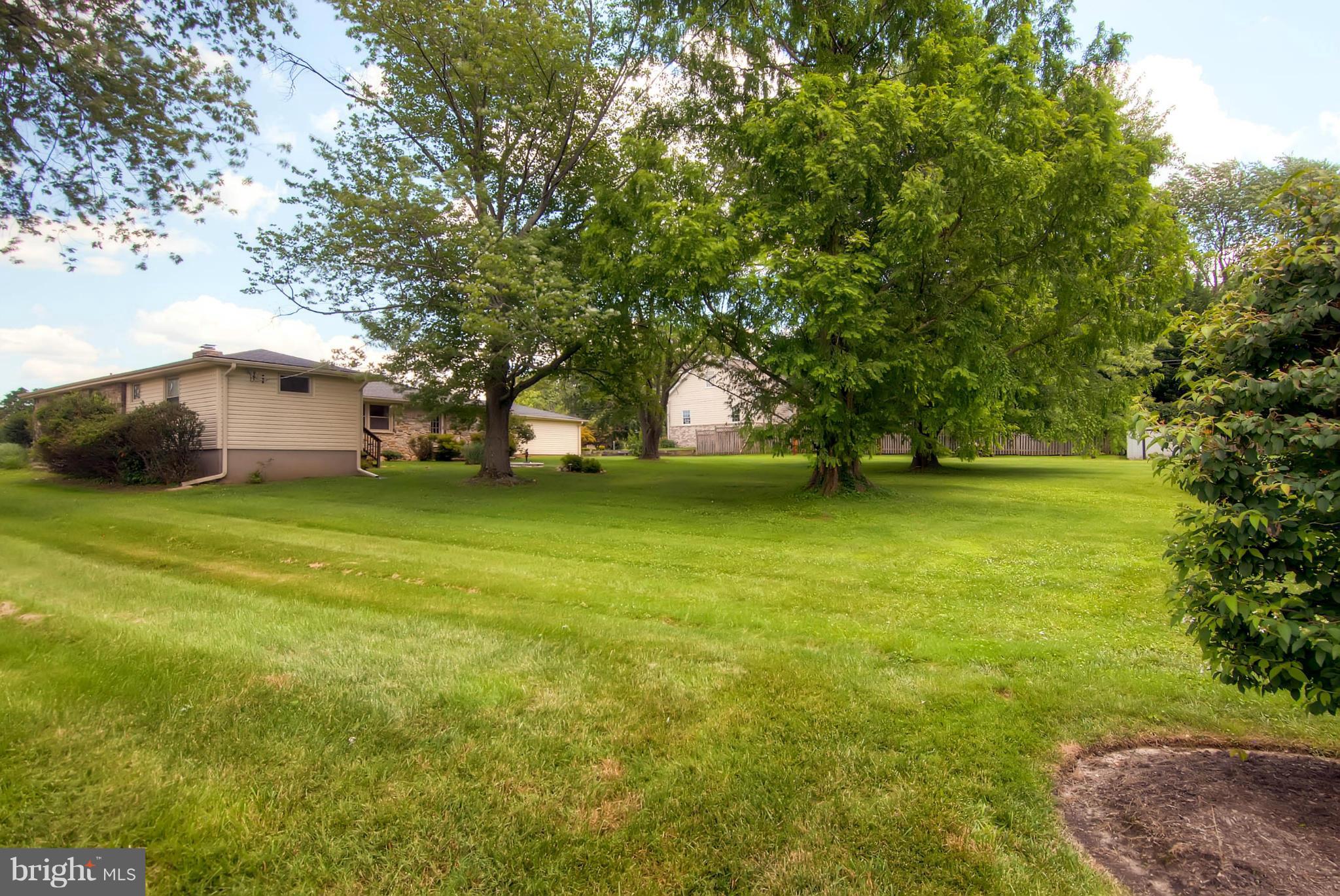 1202 Windy Gate Road Towson, MD 21286 - Photo 27 of 29 a view of a field of grass and trees