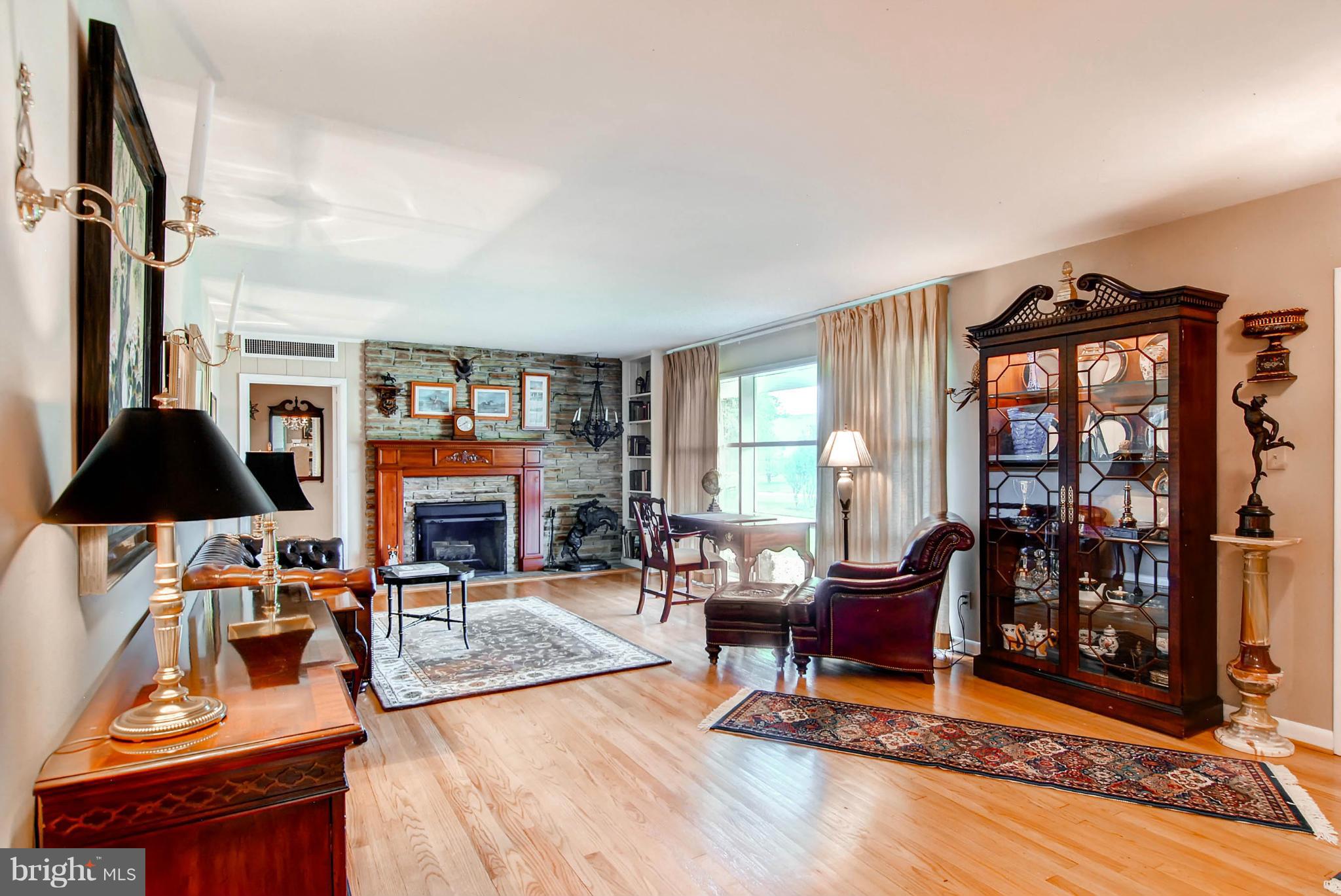 1202 Windy Gate Road Towson, MD 21286 - Photo 6 of 29 a living room with furniture a rug and a floor to ceiling window