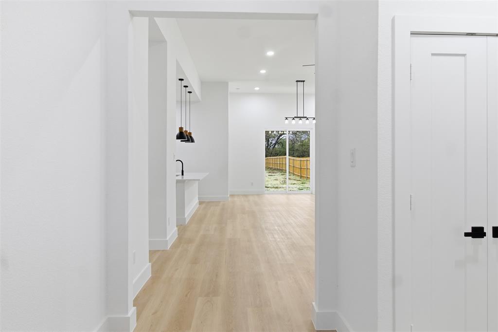 1119 Riverwood Road Dallas, TX 75217 - Photo 26 of 32 Hall featuring light wood finished floors and recessed lighting