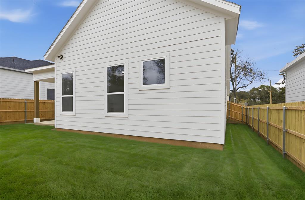 1119 Riverwood Road Dallas, TX 75217 - Photo 28 of 32 Back of house featuring a fenced backyard