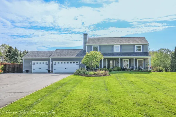 a view of house with outdoor space and yard
