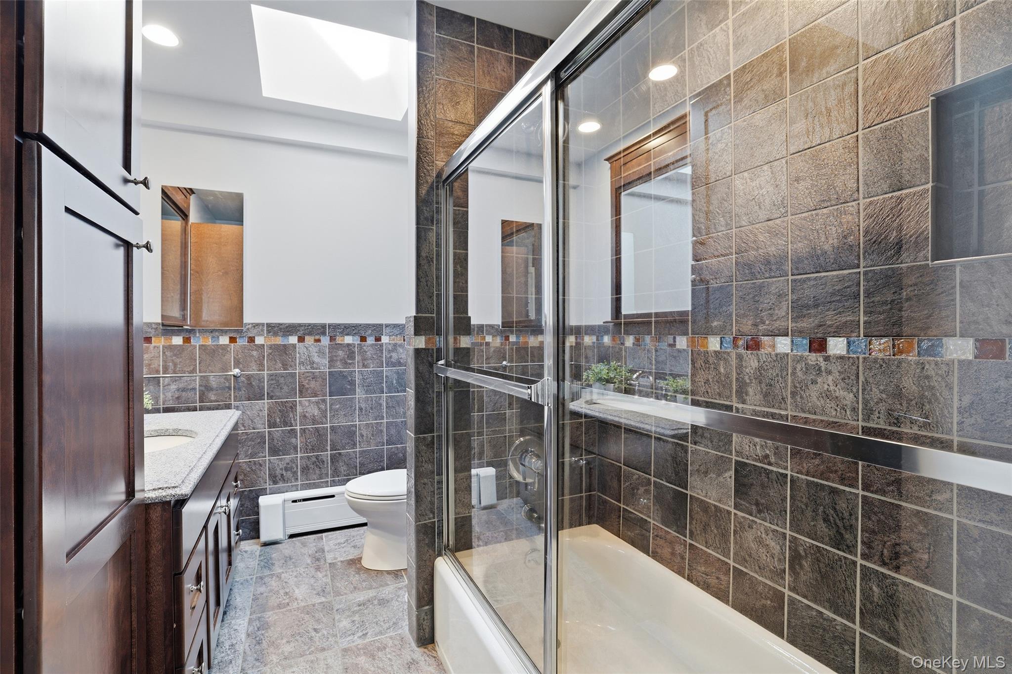 331 Old Colony Road Hartsdale, NY 10530 - Photo 18 of 45 a bathroom with a bathtub and a sink