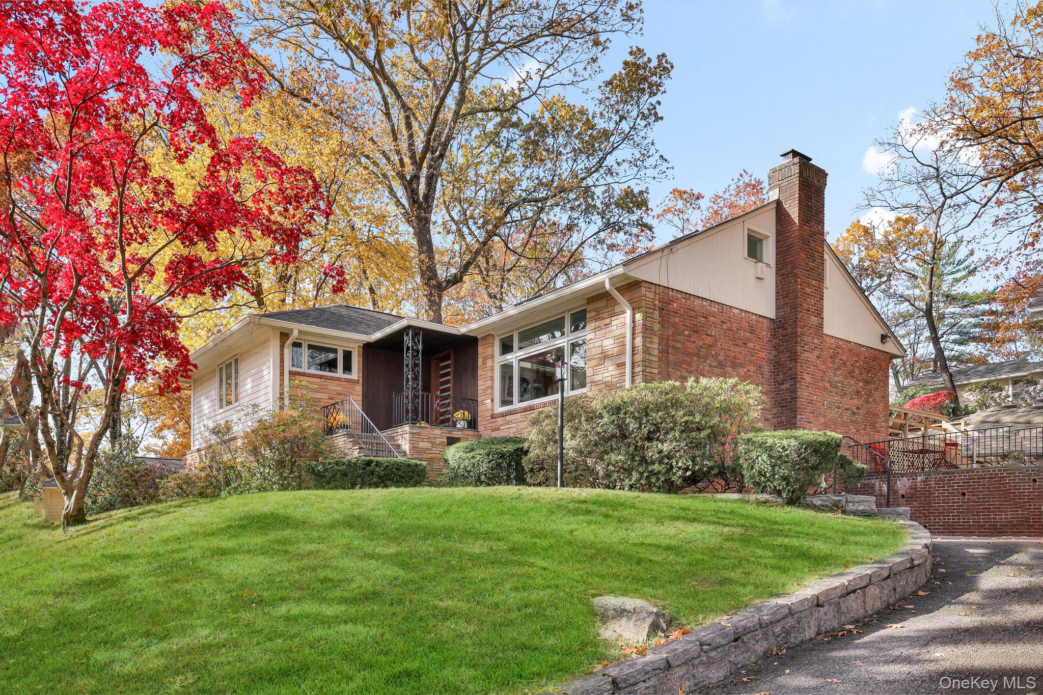 331 Old Colony Road Hartsdale, NY 10530 - Photo 2 of 45 a front view of house with yard and green space