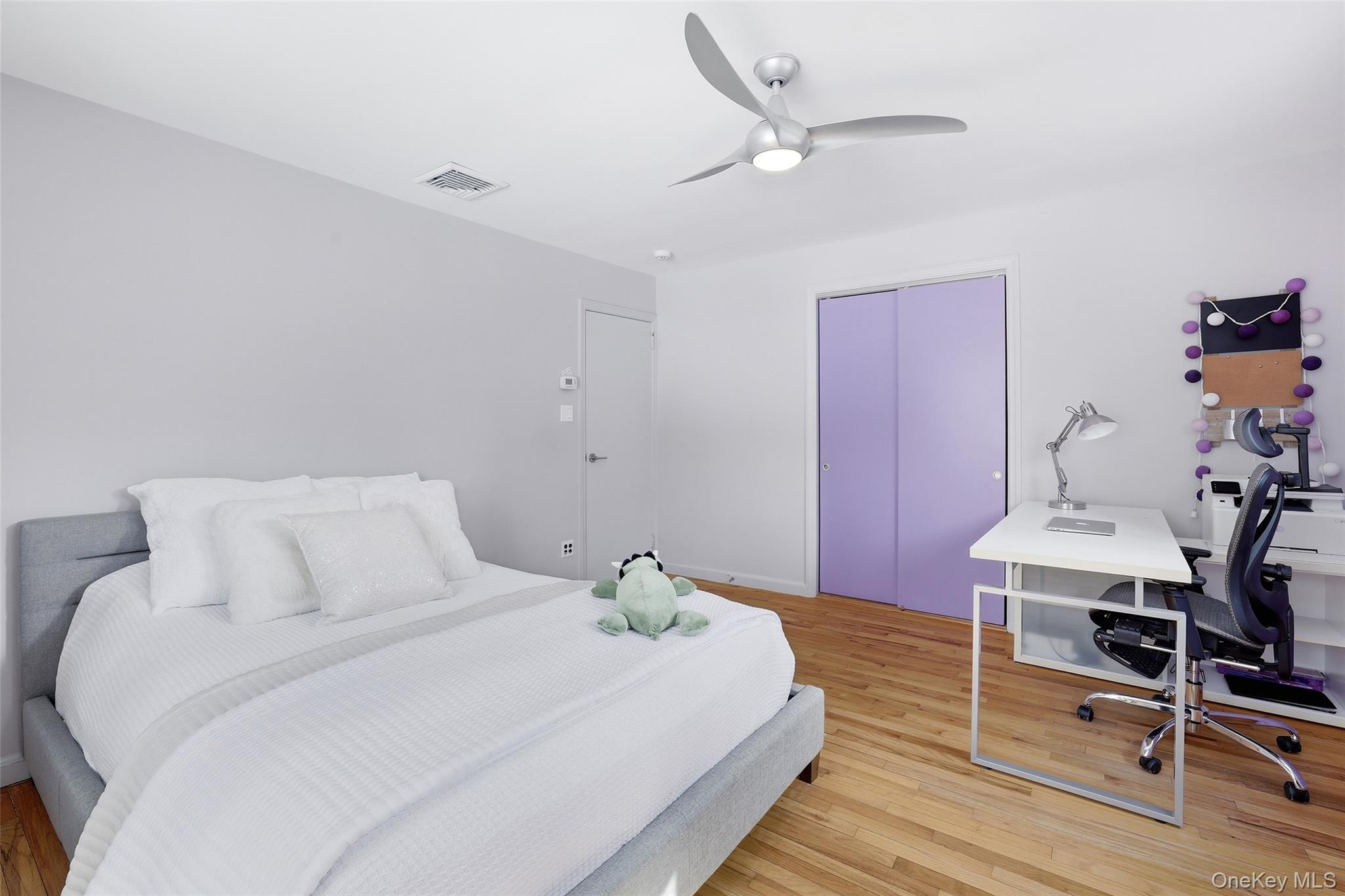 331 Old Colony Road Hartsdale, NY 10530 - Photo 21 of 45 a bedroom with a bed and a table in it