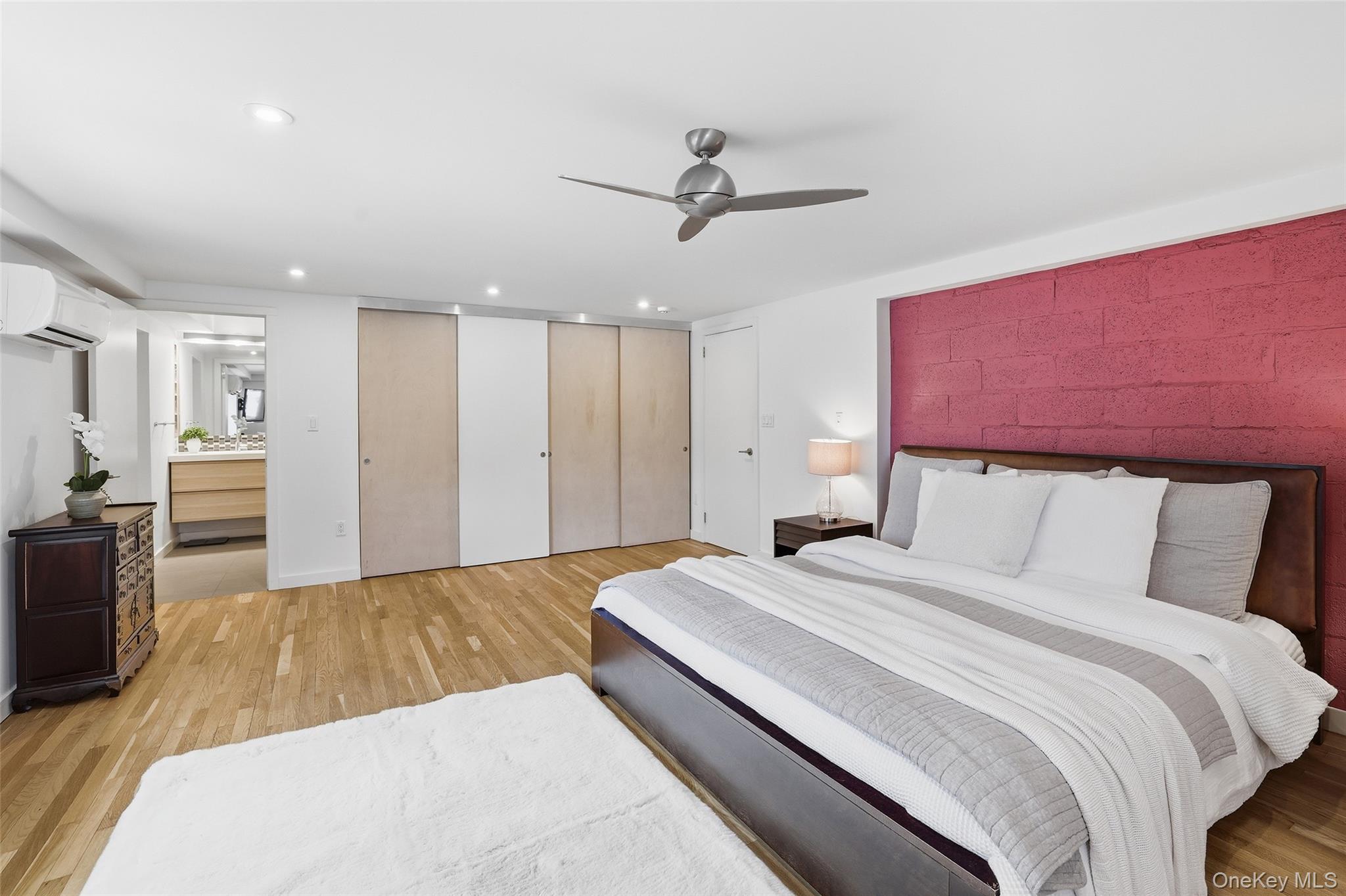 331 Old Colony Road Hartsdale, NY 10530 - Photo 28 of 45 a bedroom with a large bed and a chandelier