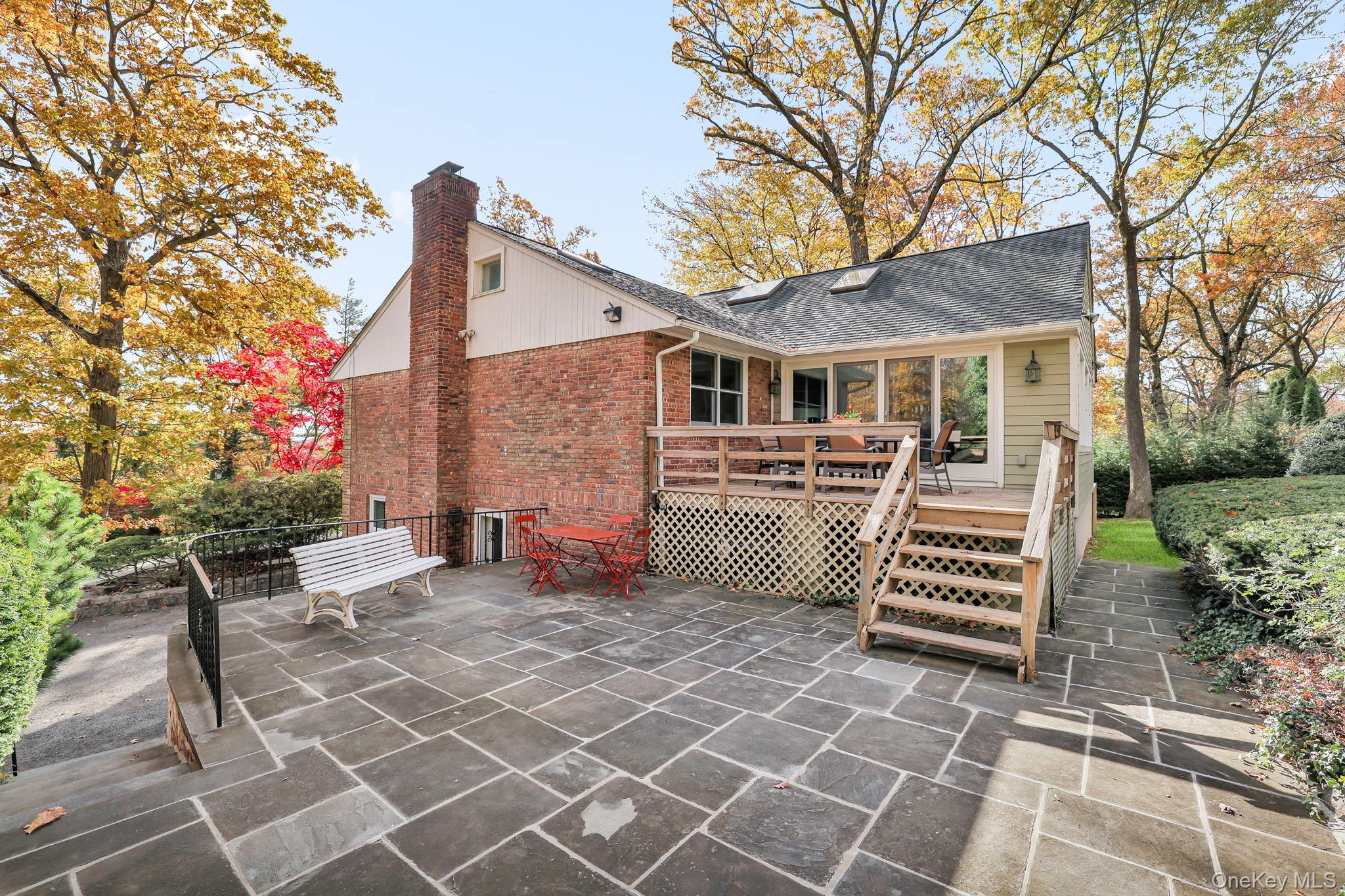 331 Old Colony Road Hartsdale, NY 10530 - Photo 36 of 45 a front view of a house with a garden