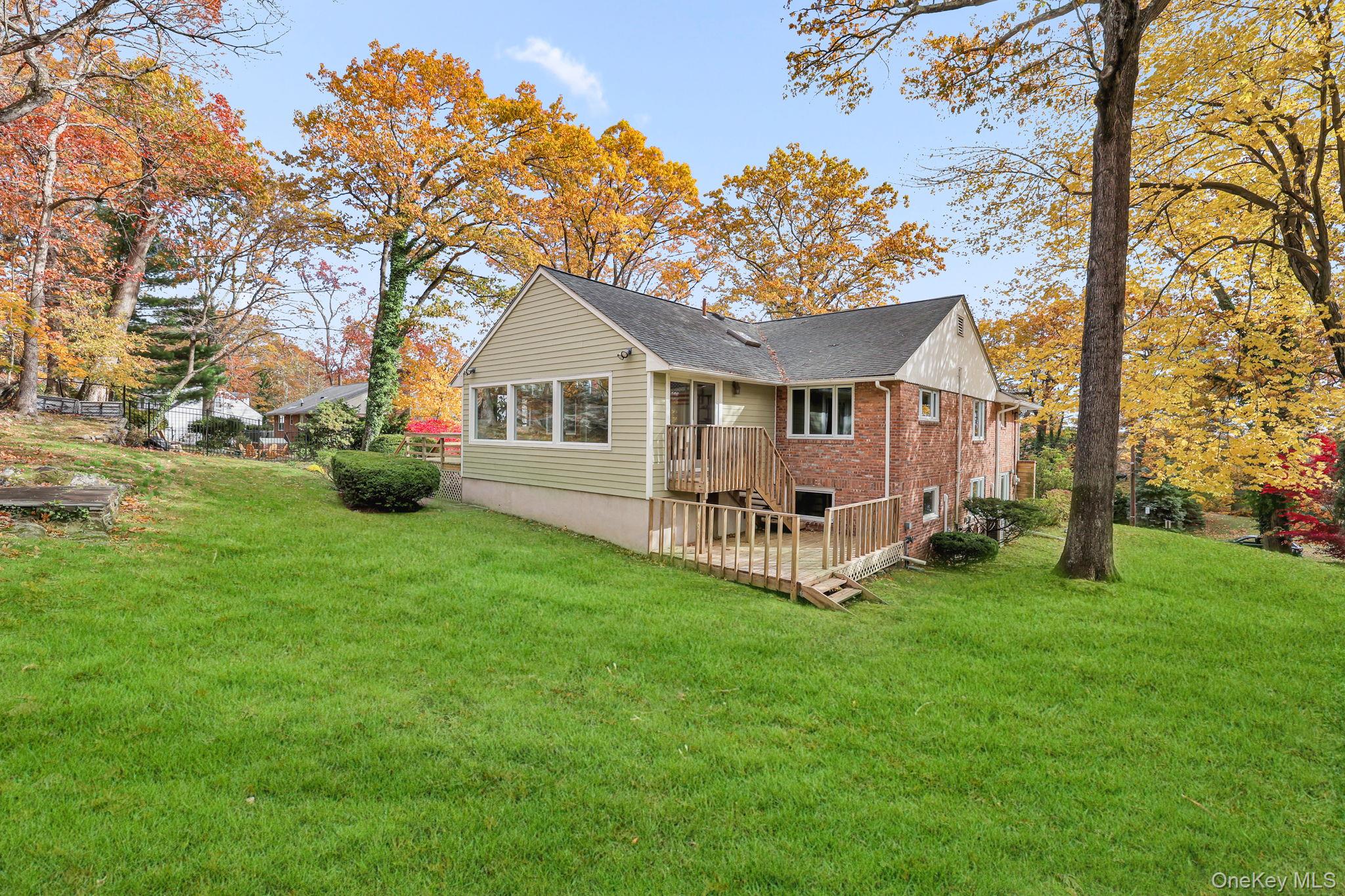 331 Old Colony Road Hartsdale, NY 10530 - Photo 40 of 45 a view of a house with a yard and sitting area