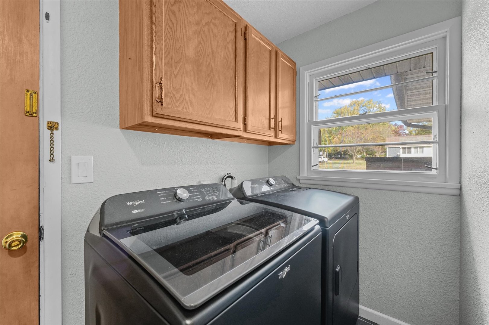 1609 West John Street Champaign, IL 61821 - Photo 15 of 30 a kitchen that has a sink and a stove