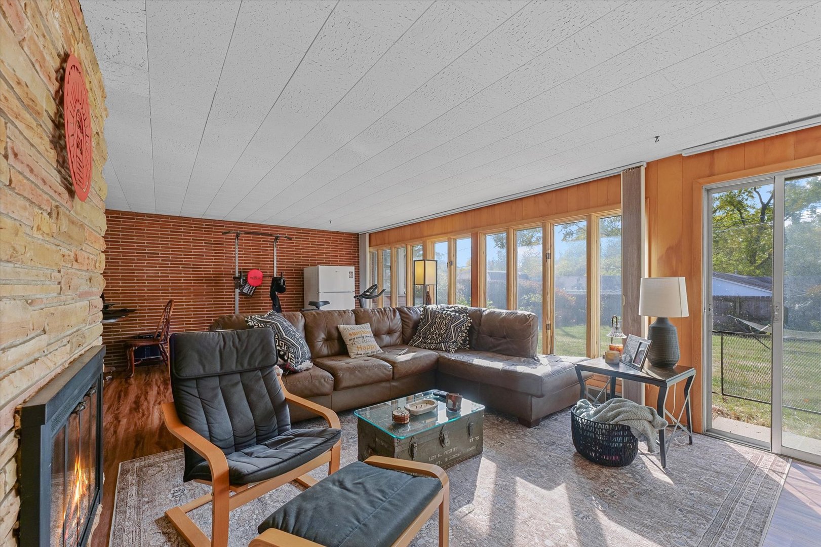 1609 West John Street Champaign, IL 61821 - Photo 16 of 30 a living room with furniture and a floor to ceiling window