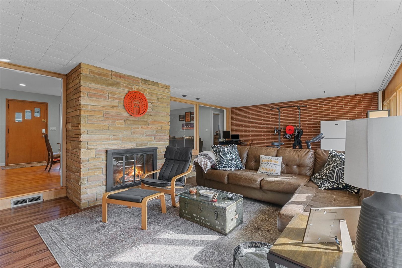 1609 West John Street Champaign, IL 61821 - Photo 17 of 30 a living room with furniture and a fireplace