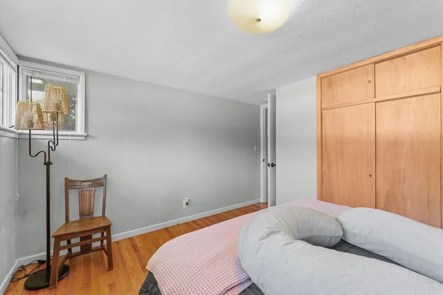 a bedroom with a bed and a table in it