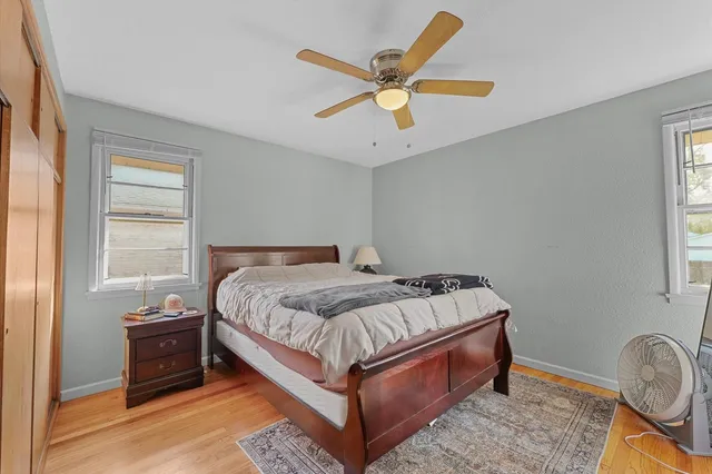 a bedroom with a bed and window