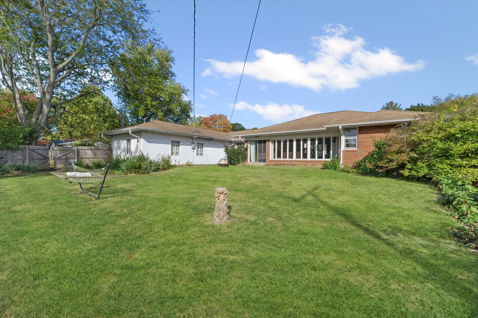 1609 West John Street Champaign, IL 61821 - Photo 28 of 30 a view of a house with a yard and sitting area