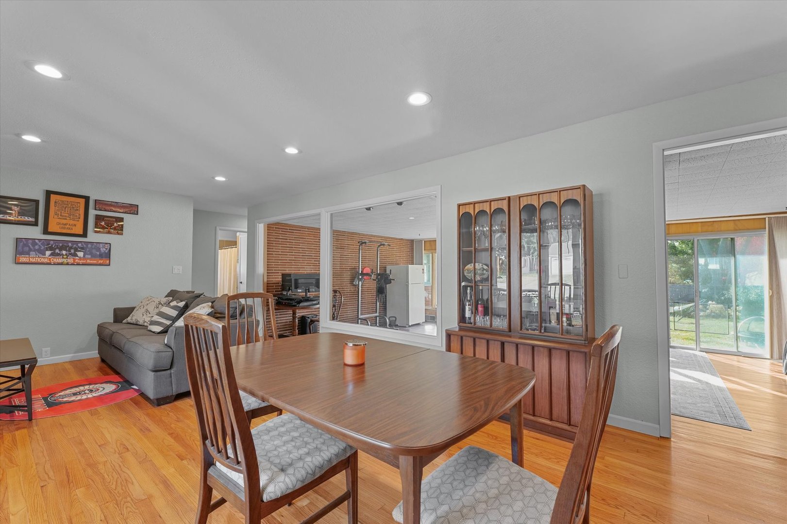 1609 West John Street Champaign, IL 61821 - Photo 10 of 30 a dining room with furniture and wooden floor