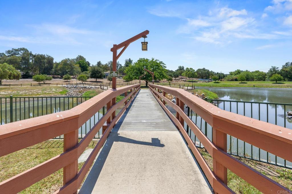 28890 Lilac Road, Unit 119 Valley Center, CA 92082 - Photo 15 of 16 a view of wooden balcony with a lake view