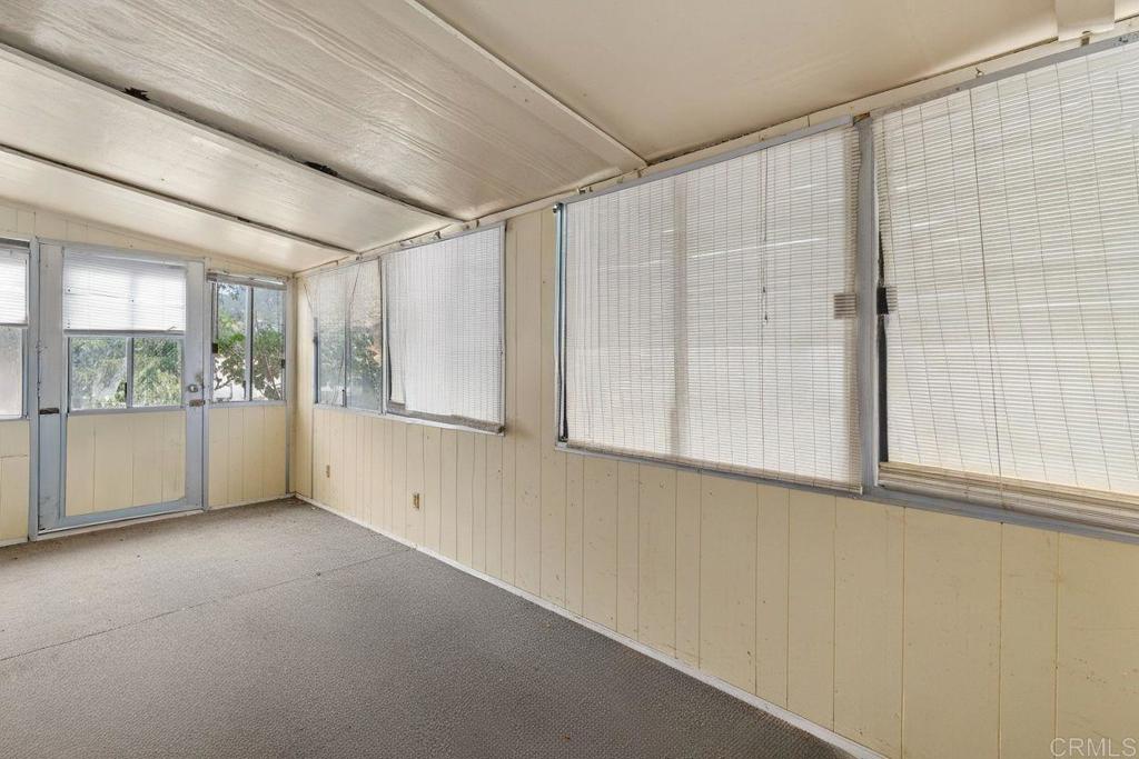 28890 Lilac Road, Unit 119 Valley Center, CA 92082 - Photo 3 of 16 a view of an empty room with a window