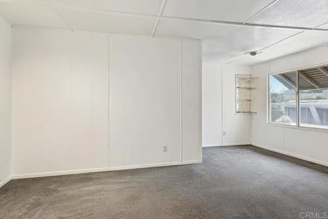 a view of empty room with windows