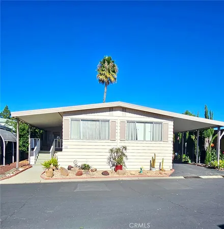 a front view of a house with a garage and a tub