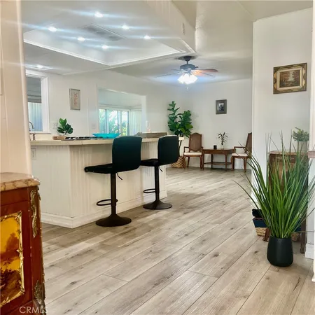 a view of a livingroom with furniture and a potted plant