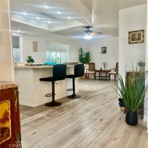 a view of a livingroom with furniture and a potted plant