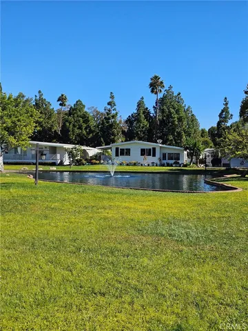 a view of a swimming pool with a table and chairs