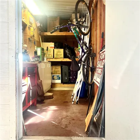 a view of living room with furniture and a fireplace