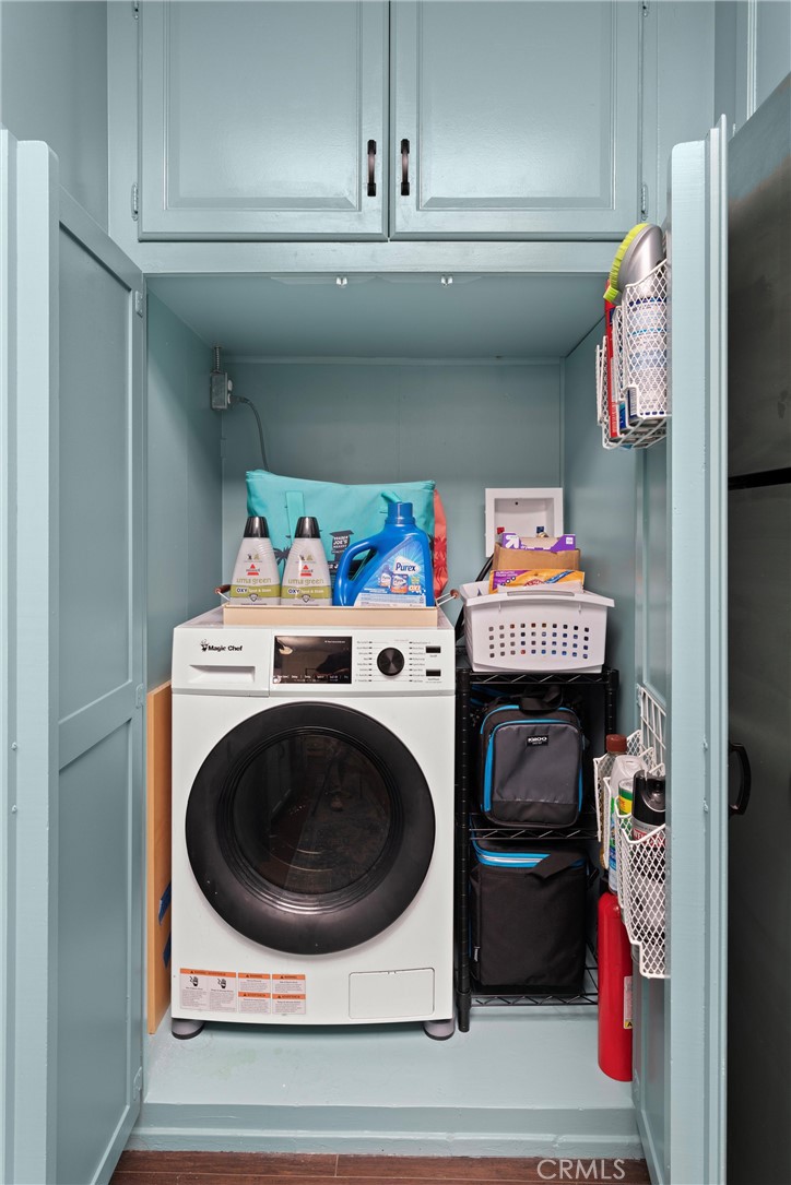 2121 Ronda Granada, Unit N Laguna Woods, CA 92637 - Photo 17 of 38 a utility room with dryer and washer