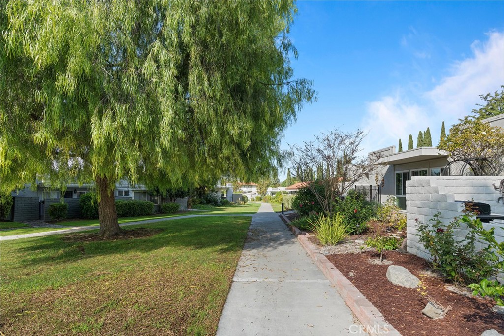 2121 Ronda Granada, Unit N Laguna Woods, CA 92637 - Photo 24 of 38 a front view of a house with garden