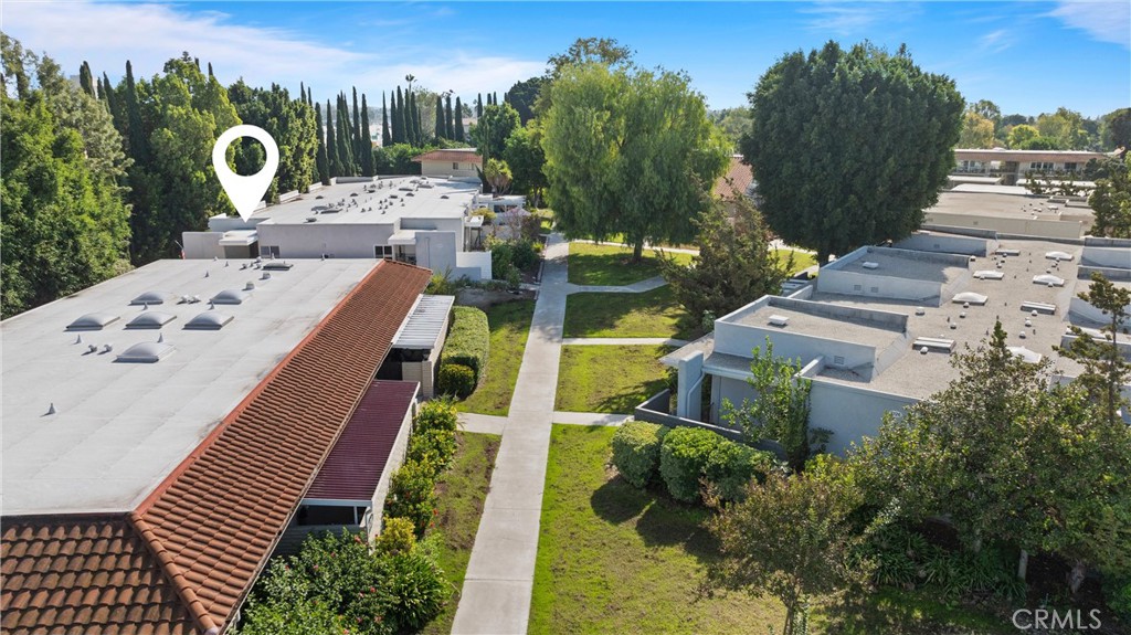 2121 Ronda Granada, Unit N Laguna Woods, CA 92637 - Photo 29 of 38 an aerial view of a house with outdoor space and trees all around