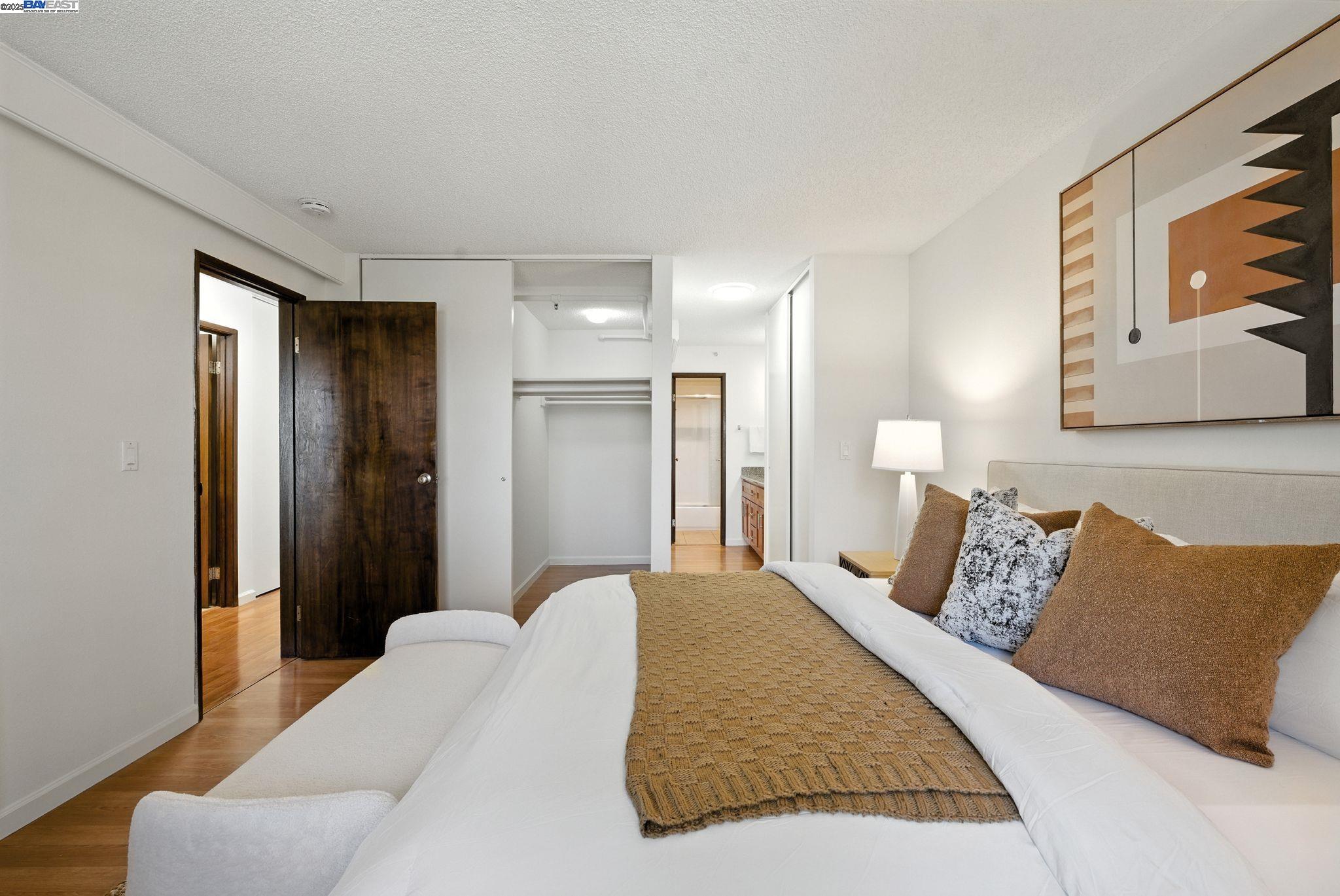 332 Philip Drive, Unit 303 Daly City, CA 94015 - Photo 21 of 55 a bedroom with a bed and a painting on the wall