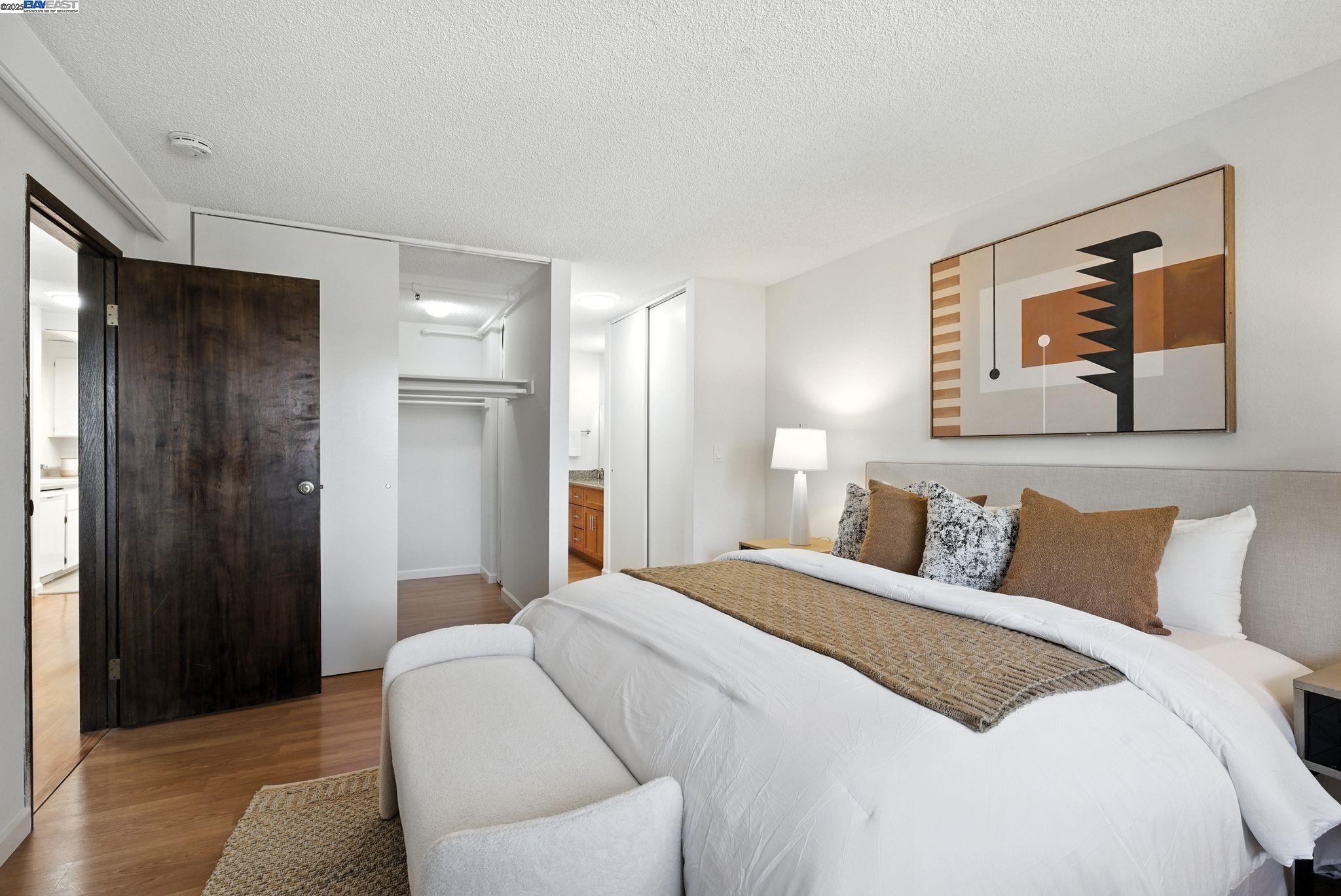 332 Philip Drive, Unit 303 Daly City, CA 94015 - Photo 22 of 55 a bedroom with a bed and a painting on the wall