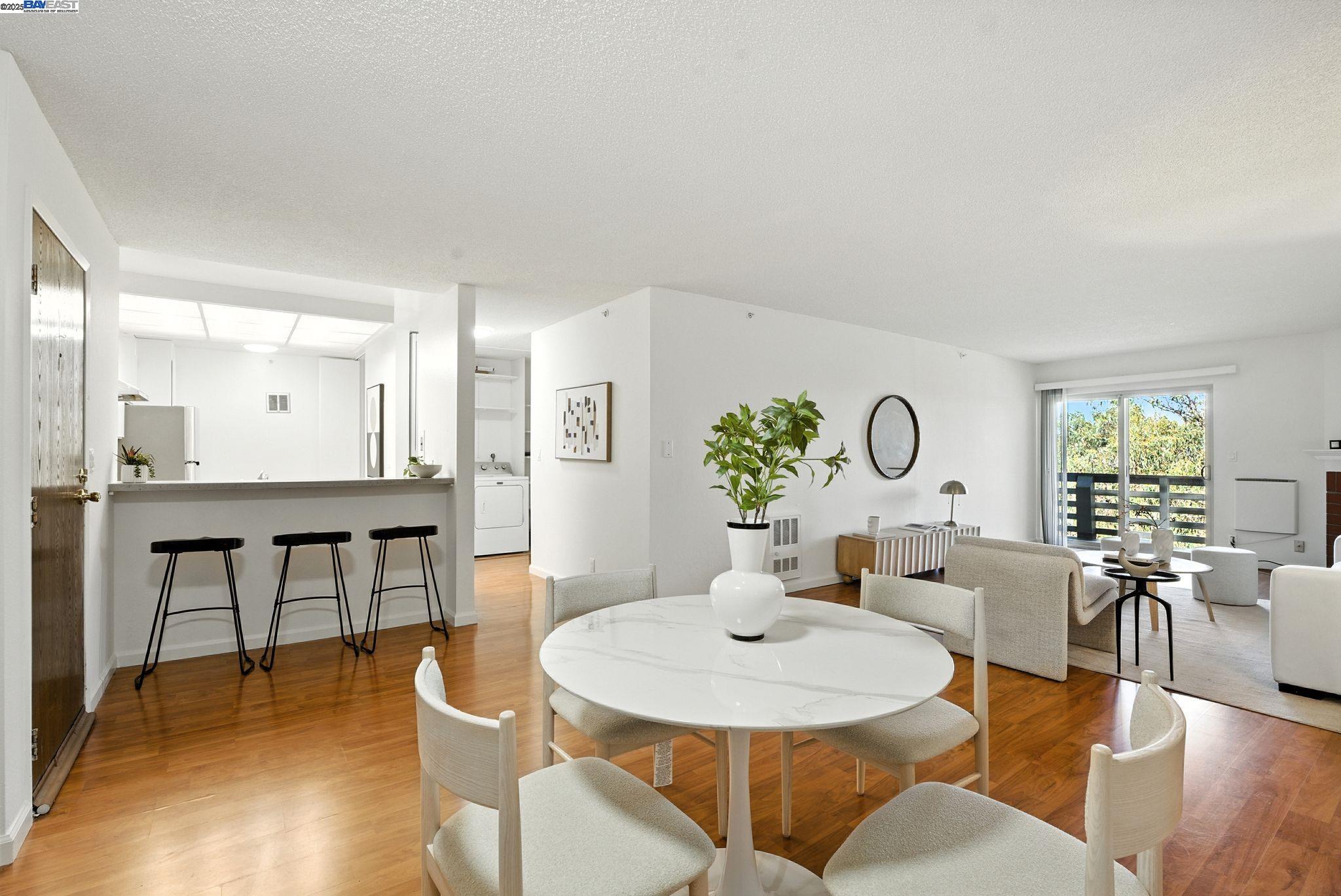 332 Philip Drive, Unit 303 Daly City, CA 94015 - Photo 6 of 55 a view of a dining room with furniture and wooden floor