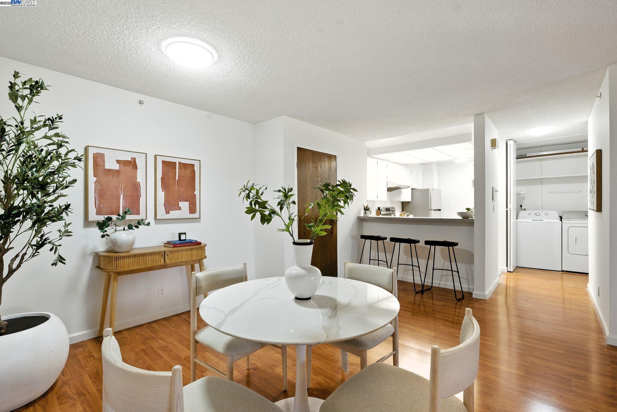 332 Philip Drive, Unit 303 Daly City, CA 94015 - Photo 8 of 55 a dining room with furniture and wooden floor