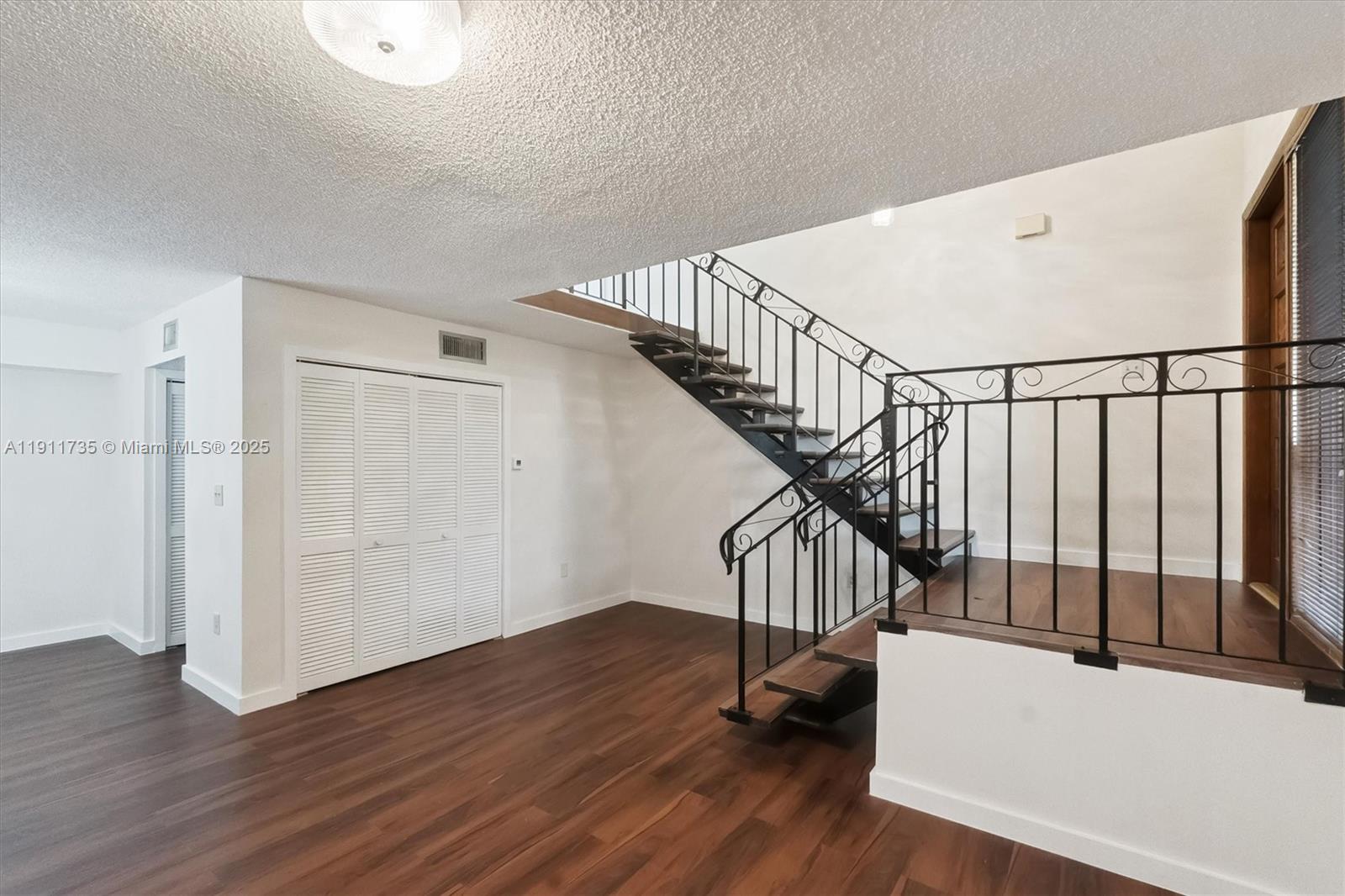 5975 Southwest 137th Avenue, Unit 702 Miami, FL 33183 - Photo 5 of 15 a view of entryway with wooden floor