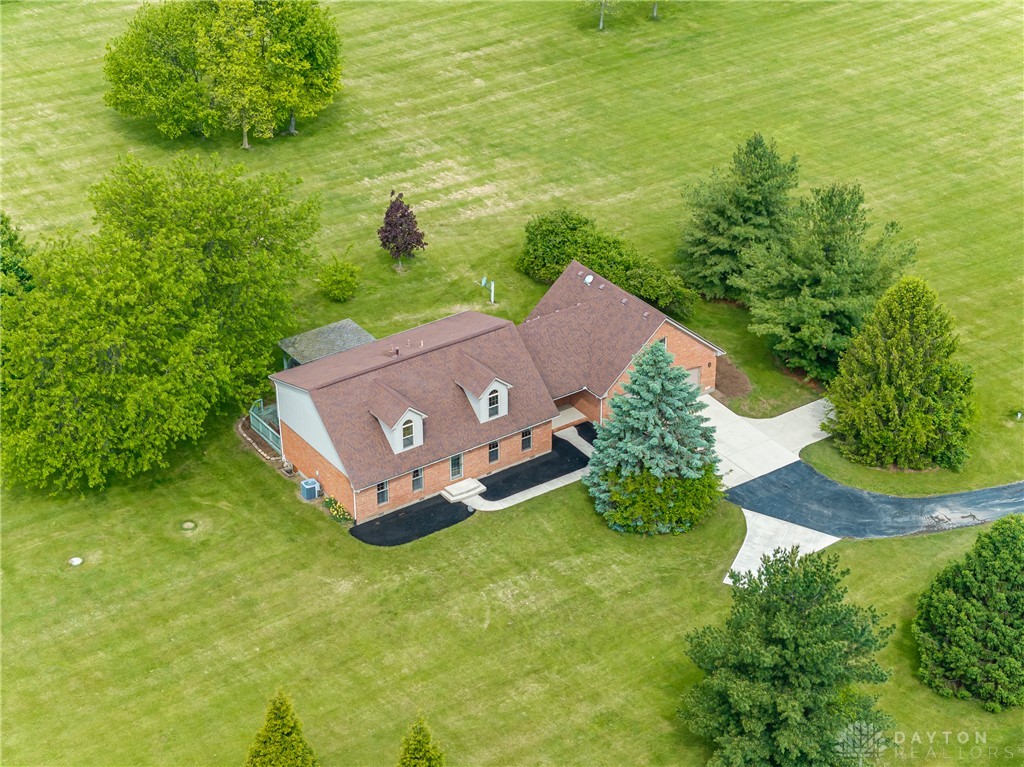 9981 Ridge Acres Lane Englewood, OH 45322 - Photo 61 of 73 Nestled on expansive grounds, this residence offers tranquility and verdant views.