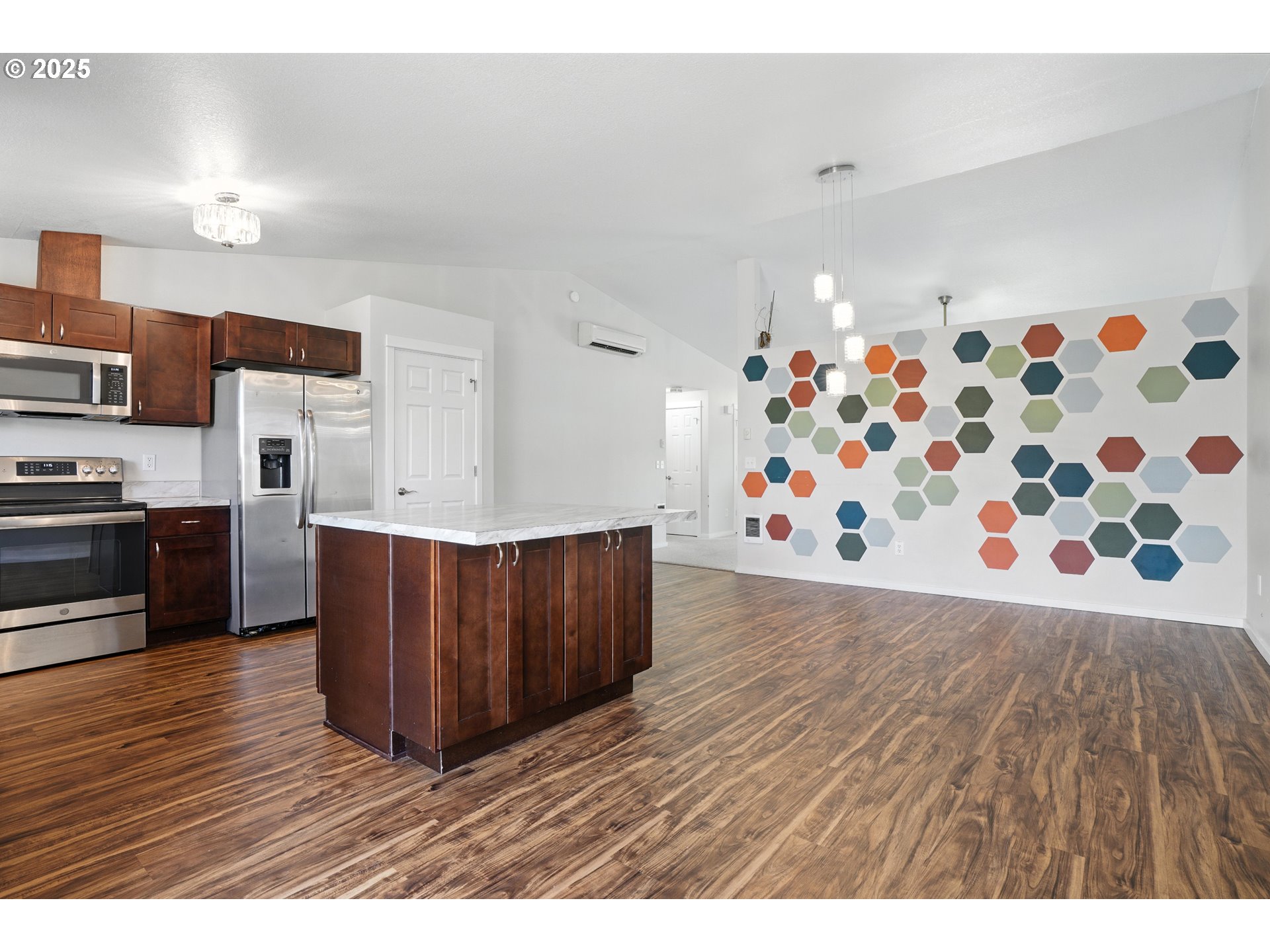 1608 Northwest 3rd Street Battle Ground, WA 98604 - Photo 12 of 26 a kitchen with wooden floors and wooden cabinets