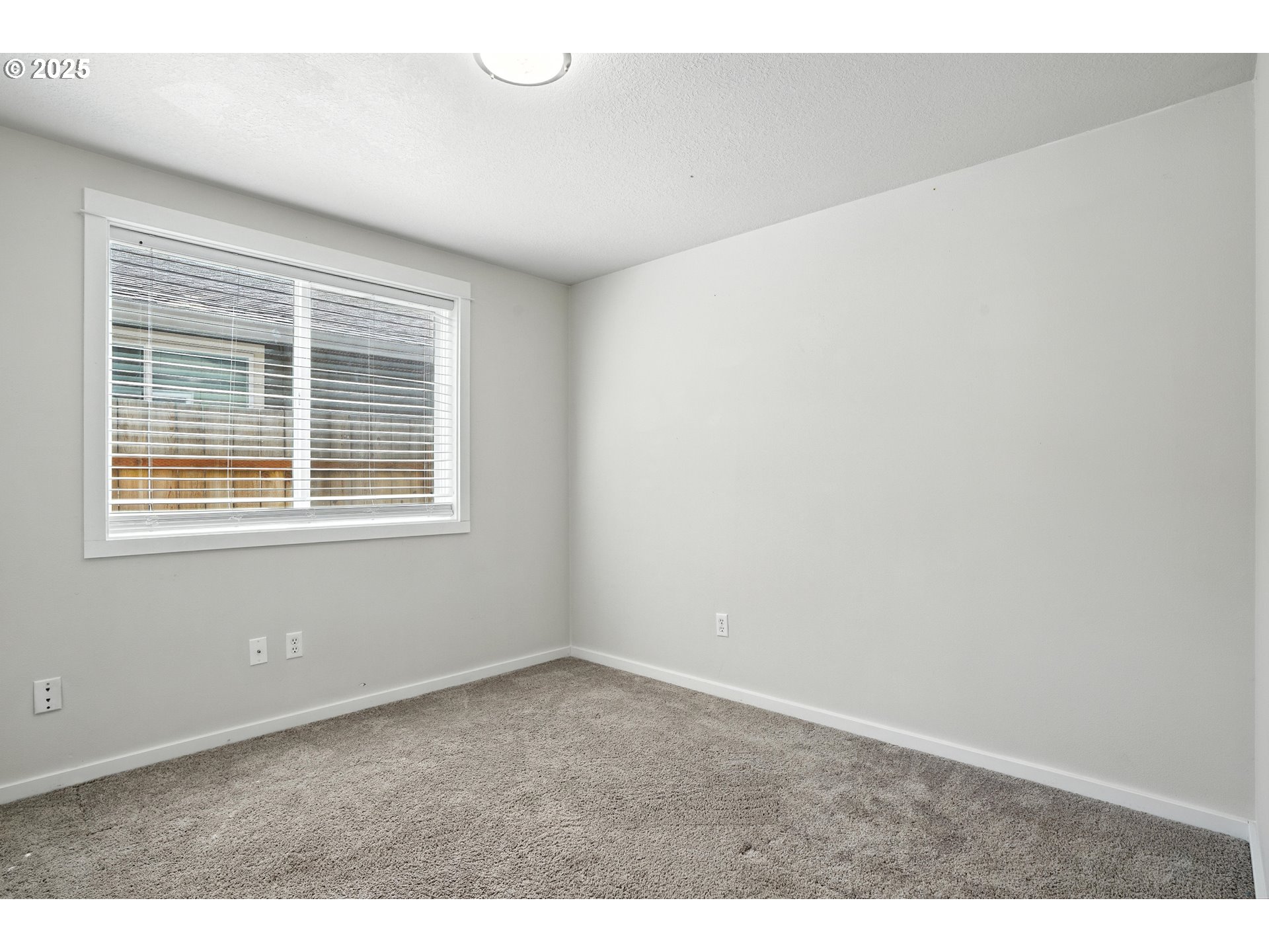 1608 Northwest 3rd Street Battle Ground, WA 98604 - Photo 14 of 26 a view of an empty room with a window