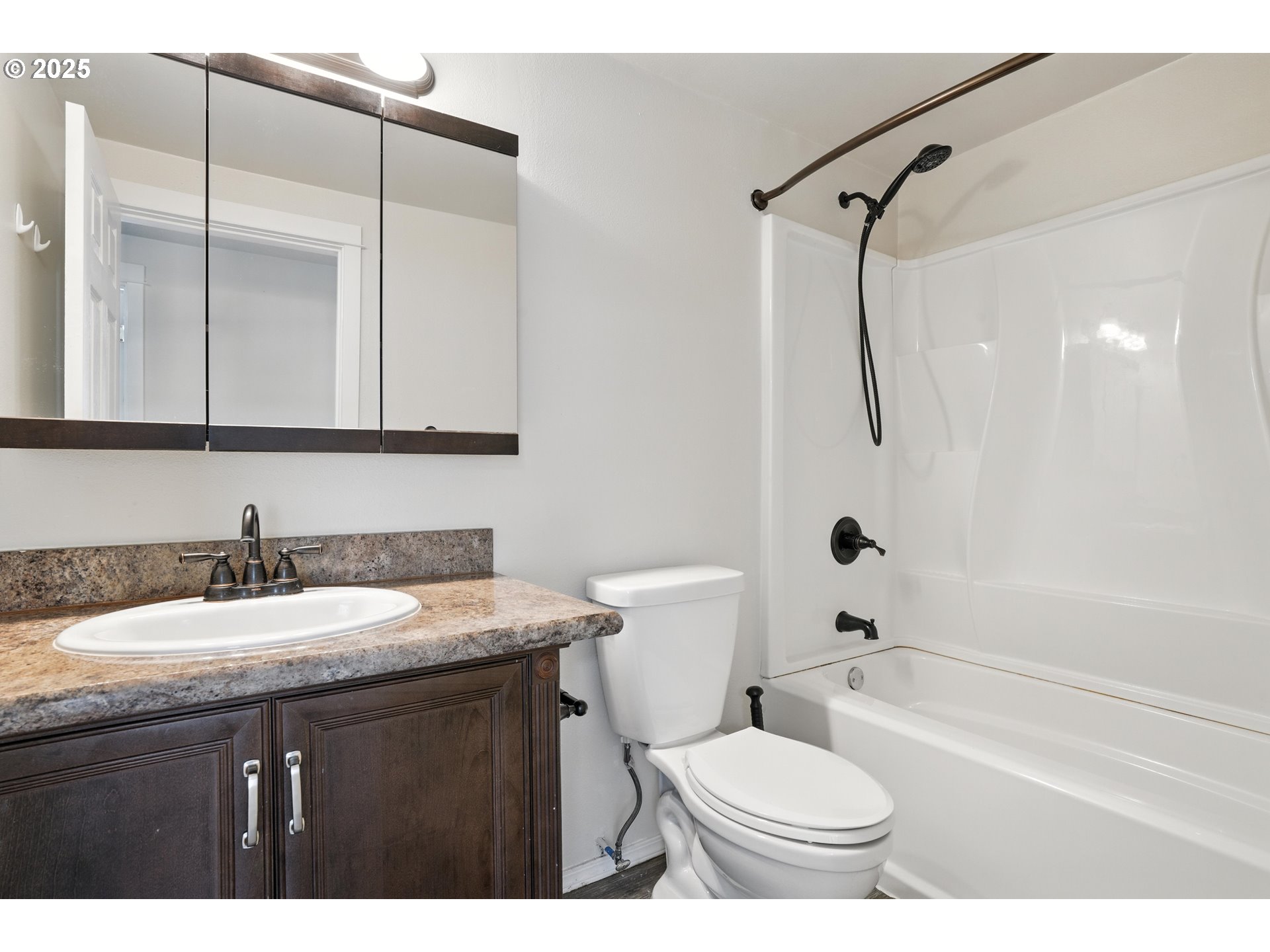 1608 Northwest 3rd Street Battle Ground, WA 98604 - Photo 15 of 26 a bathroom with a sink toilet vanity and shower