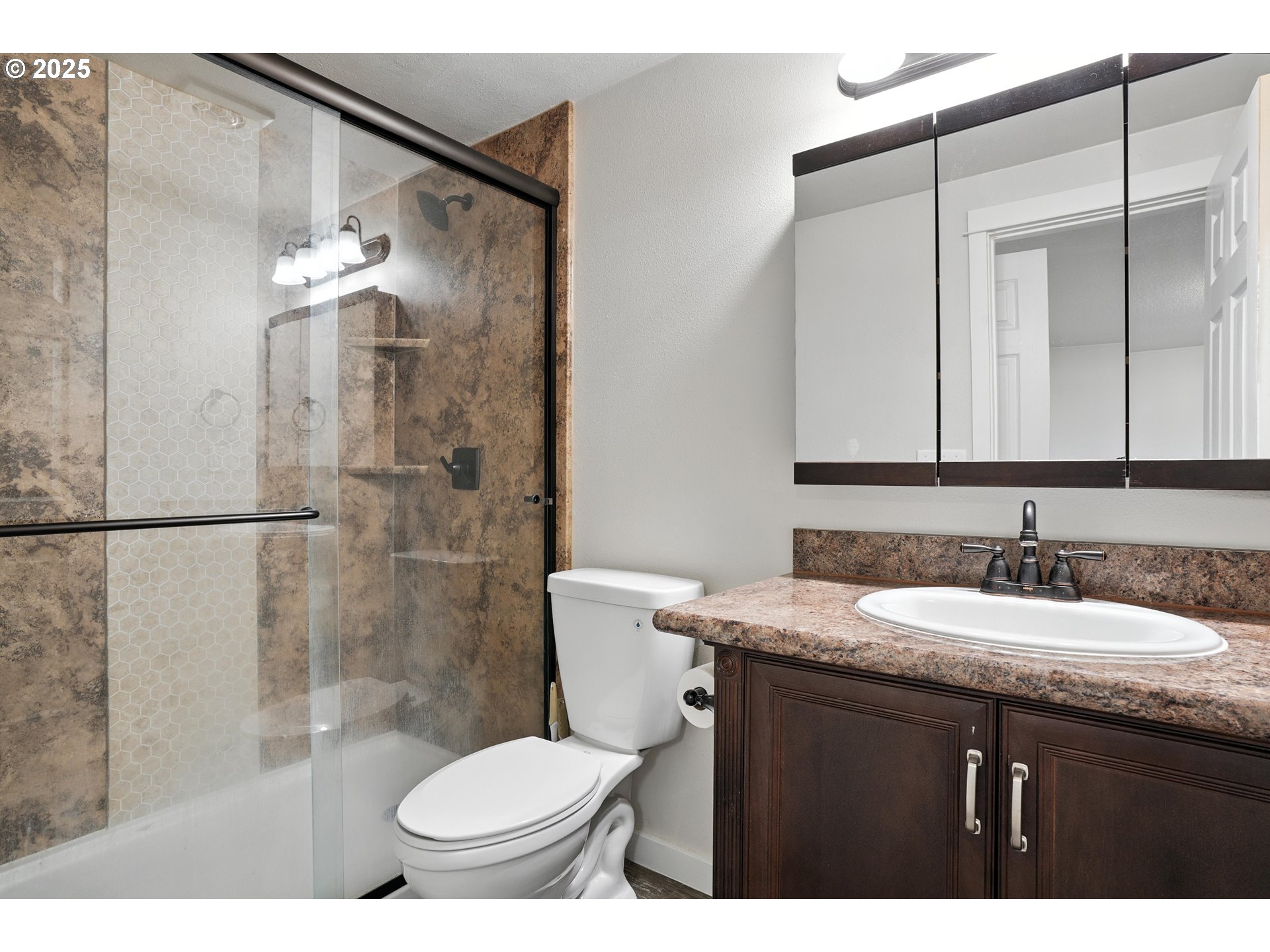 1608 Northwest 3rd Street Battle Ground, WA 98604 - Photo 20 of 26 a bathroom with a sink toilet and shower