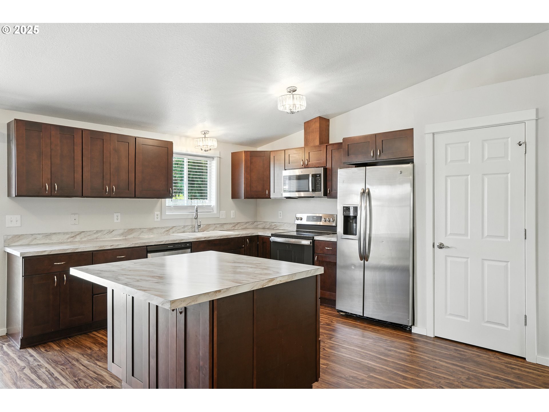 1608 Northwest 3rd Street Battle Ground, WA 98604 - Photo 9 of 26 a kitchen with cabinets and stainless steel appliances