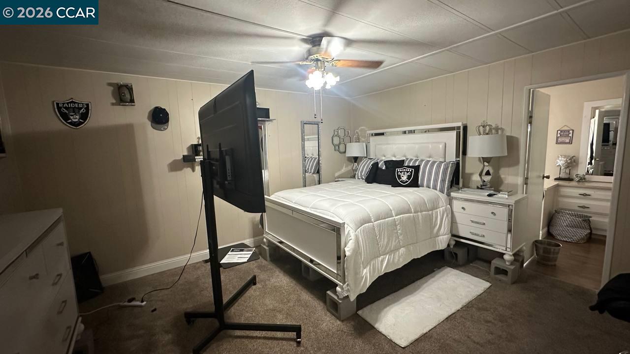 367 Ravine Circle Rancho Cordova, CA 95670 - Photo 15 of 21 a white bed sitting in a room next to a window with pc on the table