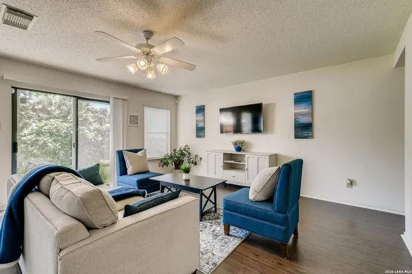 a living room with furniture and a large window