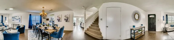 a view of entryway with furniture and wooden floor