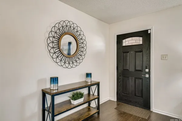 a view of entryway with wooden floor